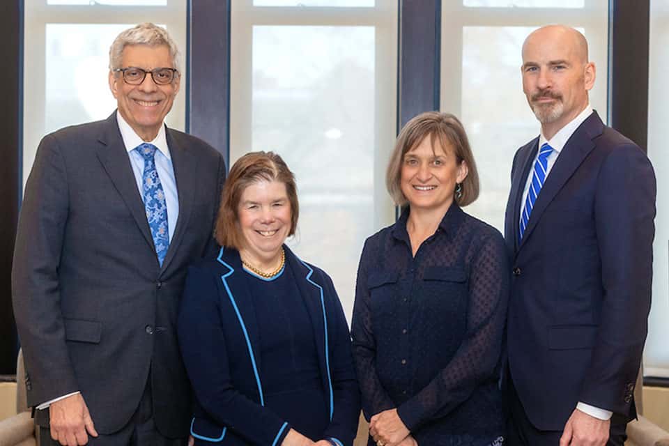 A posed portrait of Fred Pestello, Fran Pestello, Kathy Feser and Edward J. Feser