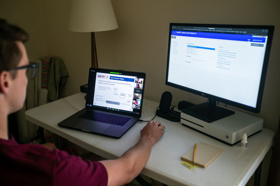 Picture of student in front of computer screen