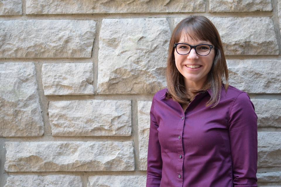 Katie Kelting, Ph.D. poses for a photo in the Shanahan Atrium of the Chaifetz School of Business's Cook Hall.