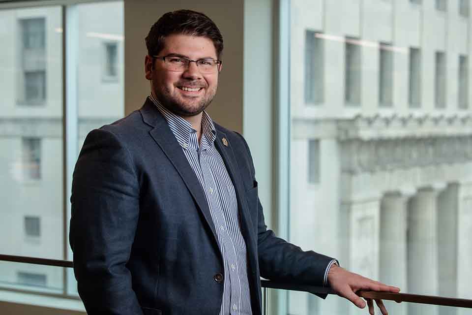 Nick Weaver poses for a photo at the law school.