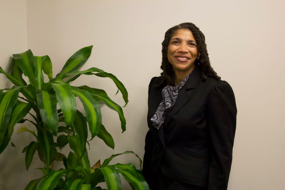 Professor Griggs poses in Scott Hall