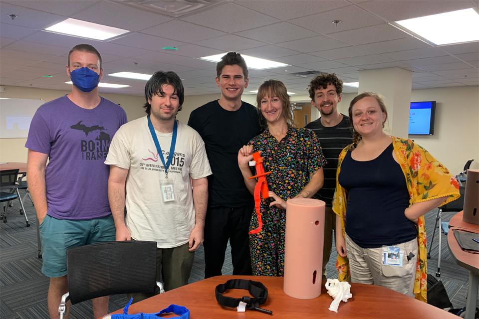 MD PhD trainees, Elisabeth D., Robert K., Reagan M., Carter G standing next to one another at the Stop the Bleeding training 