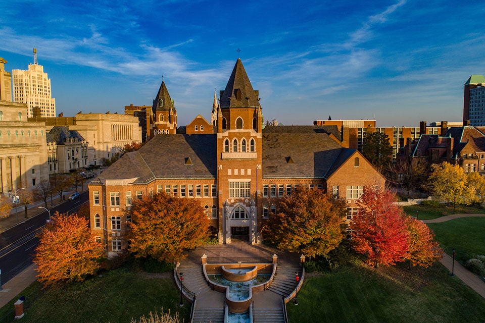 A photo of SLU's Richard A. Chaifetz School of Business shot at sunset.