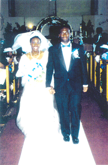Anderson and her husband walk down the aisle on their wedding day.